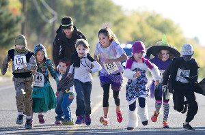 CHIEFTAIN PHOTO/BRYAN KELSEN Some of the costume-clad youngsters taking part in the Mini Monster Dash 50 yard run begin their run from the starting line Saturday morning at DiSanti Farms on South Road. The free race was just prior to the Monster Dash 5K run to benefit the Junior League of Pueblo. See story, Page 5B.